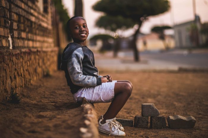 boy-sitting-on-dirt-3177662-e1574632781236